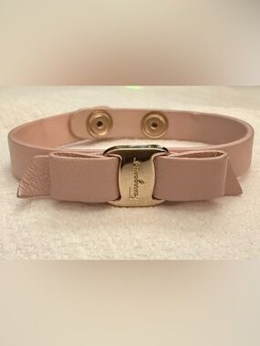 Salvatore Ferragamo Pink Leather Bow Bracelet with Gold Tone Logo